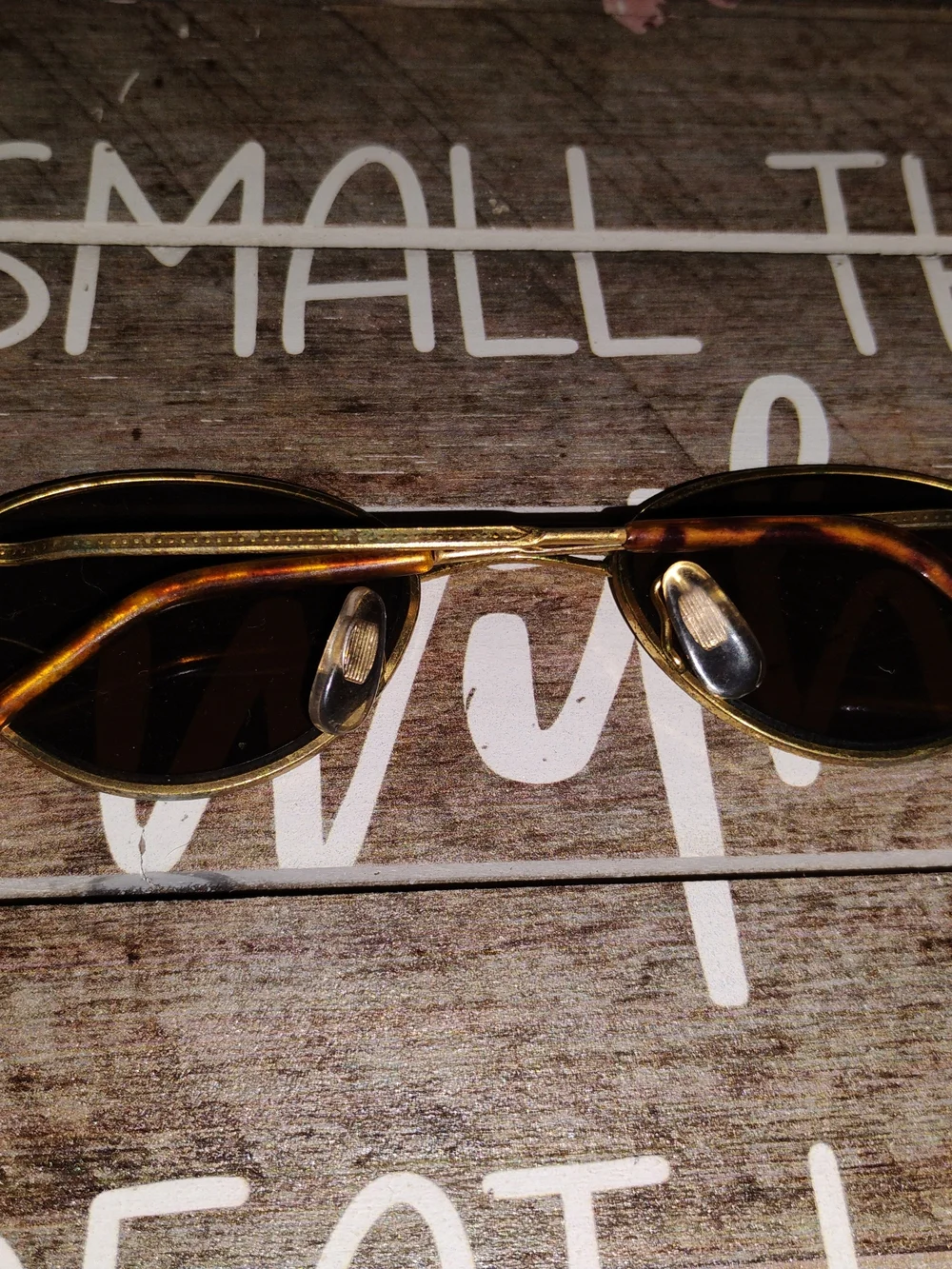 Ray-Ban Gold Oval Sunglasses with Dark Lenses